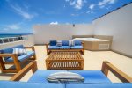Terrace with chairs and jacuzzi